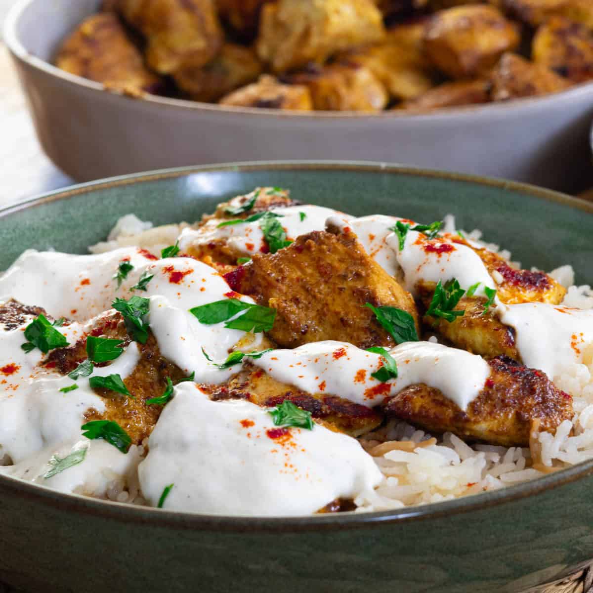 Chicken kebabs topped with garlic yogurt sauce