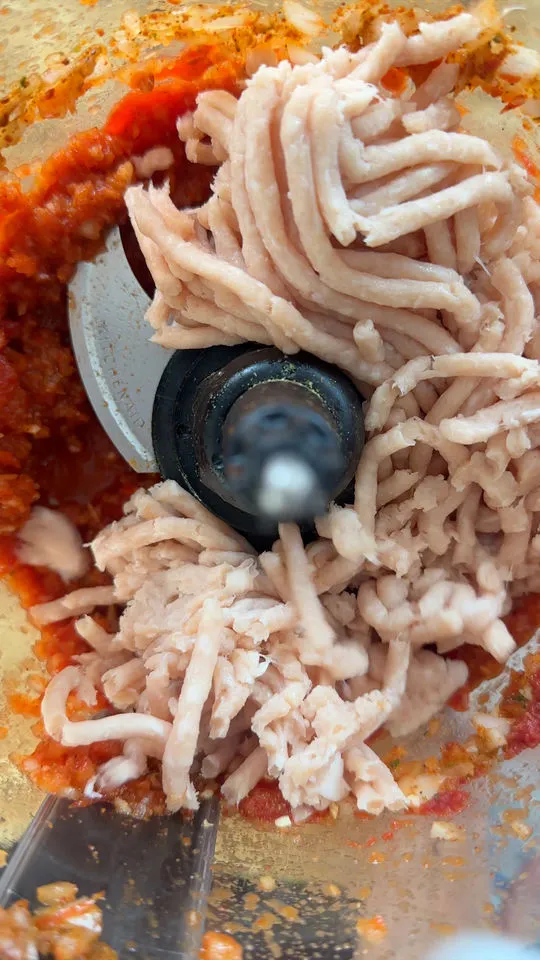 Ground meat and tomato sauce in a food processor.
