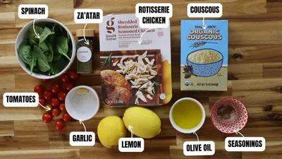 Ingredients for Za’atar Chicken Couscous Bowls with spinach, za'atar, rotisserie chicken, couscous, tomatoes, garlic, lemon, olive oil.