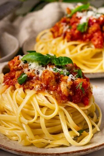 Hidden Veggie Pasta Sauce over some whole wheat spaghetti with freshly grated cheese and basil.