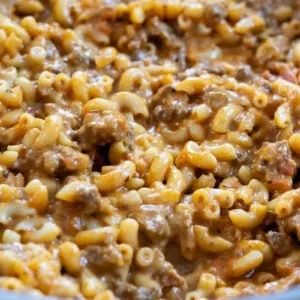 Creamy beef and macaroni pasta dish, richly seasoned and freshly cooked. Comfort food in a close-up shot.